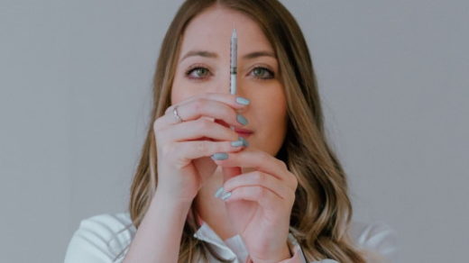 nurse readying syringe