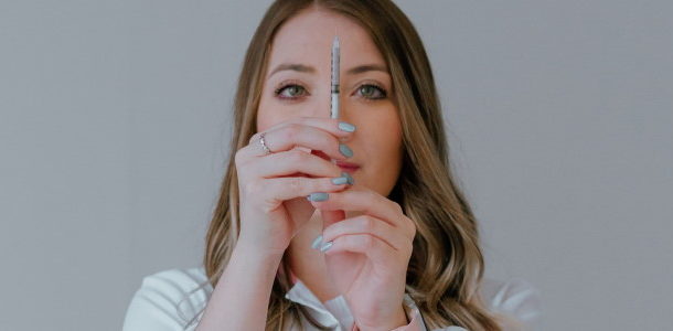 nurse readying syringe