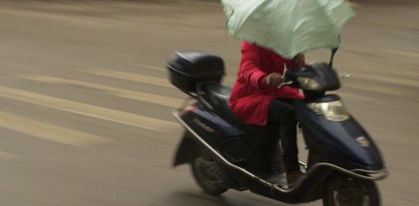 Umbrella and moped