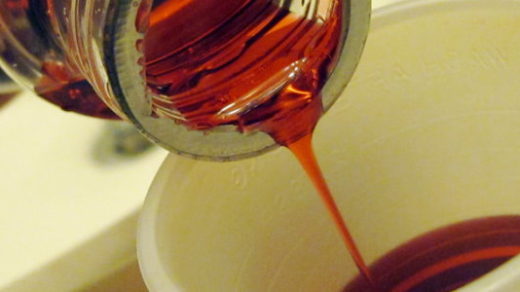 pouring some cough syrup