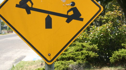 smash cropped see saw crossing sign