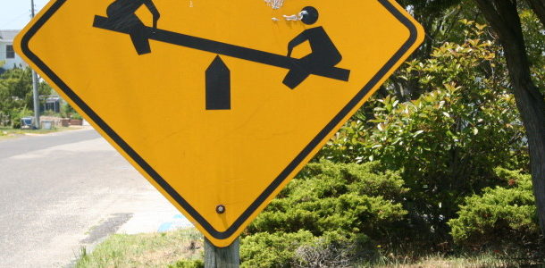 smash cropped see saw crossing sign